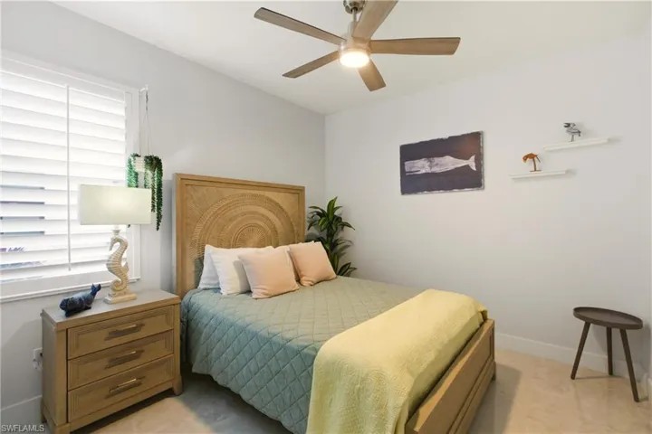 Bedroom featuring baseboards and a ceiling fan