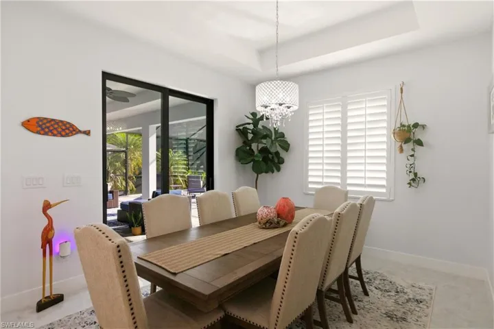 Dining area with a raised ceiling