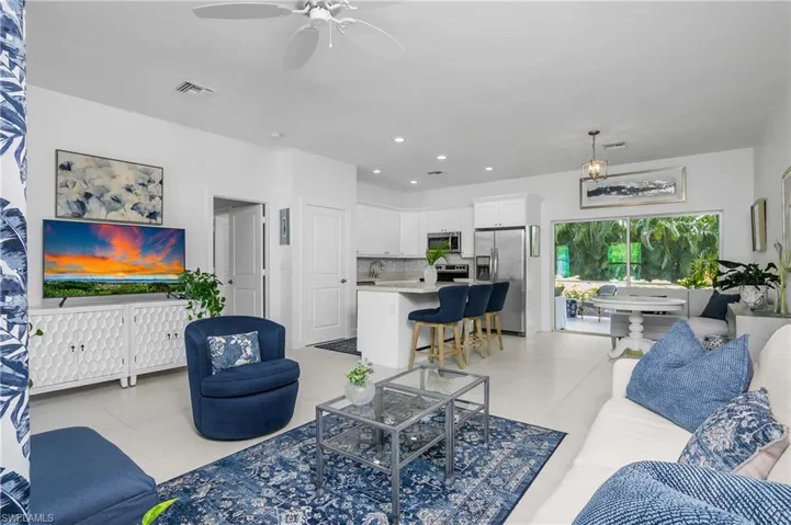 View of living room, dining room and kitchen.
