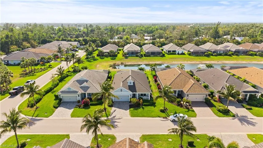 Drone / aerial view featuring a water view and a residential view