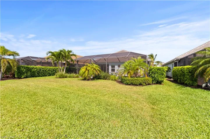 View of yard with a lanai