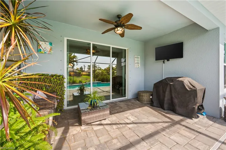 View of patio featuring grilling area and ceiling fan