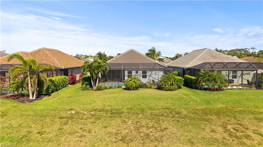 View of yard with a lanai