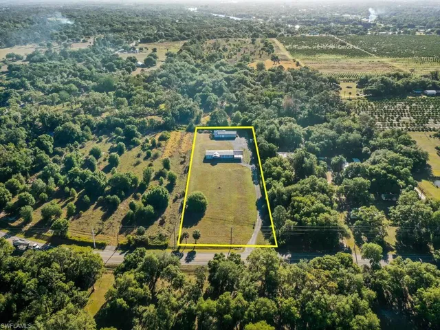 Aerial view of sparsely populated area with property boundaries highlighted
