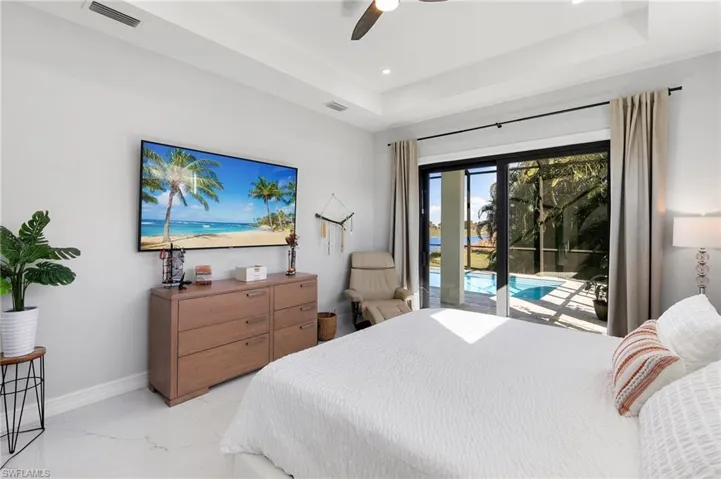 Bedroom featuring marble finish floors, access to exterior, ceiling fan, and recessed lighting