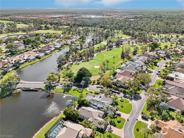 Aerial view with a water view, a residential view, and golf course view
