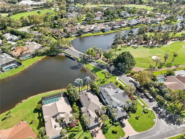 Birds eye view of property with a residential view and a water view