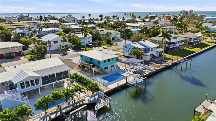 Aerial view of residential area with a nearby back bay- Virtually Edited Image