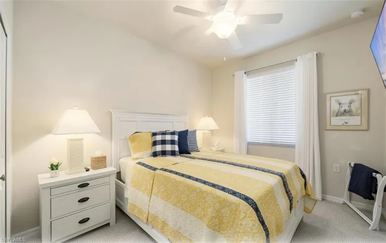 2nd Bedroom featuring light colored carpet and ceiling fan