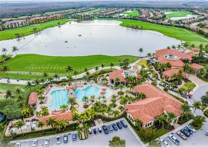 Drone / aerial view of a large body of water and a local golf course