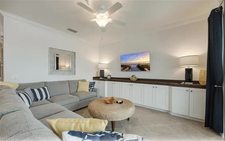Living room featuring a large built-in cabinet