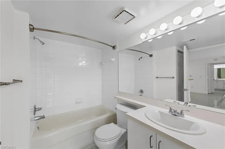 Bathroom featuring bathtub / shower combination and vanity