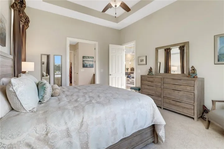 Master bedroom with tray ceiling.