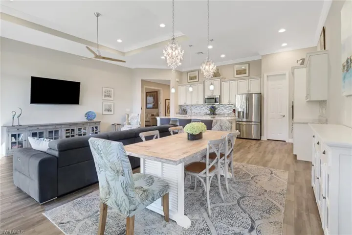 The dining room has plenty of space for a large table.  Note the gorgeous chandeliers!