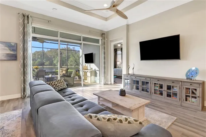 View of living room to lanai.  Open the sliders to the large lanai to create even more living/entertaining space.