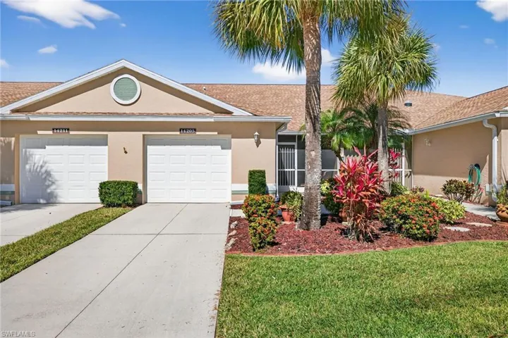 Ranch-style house featuring stucco siding, concrete driveway, a front lawn, and a garage