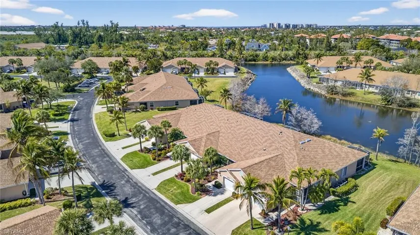 Aerial perspective of suburban area with a large body of water