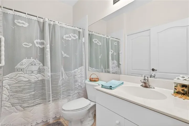 Full bathroom featuring vanity and toilet