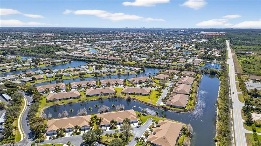 Aerial view of residential area featuring a large body of water