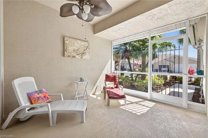 Sunroom / solarium featuring ceiling fan