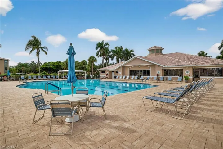 Community pool with a patio area