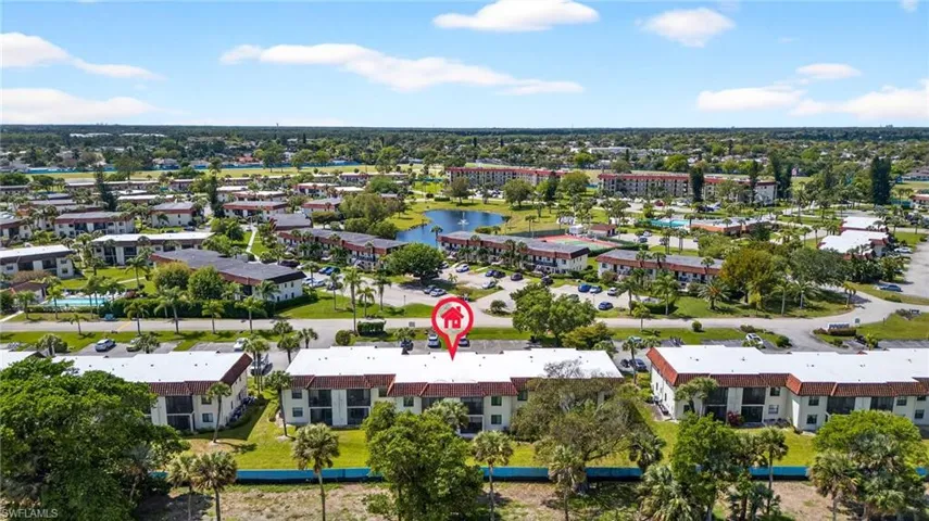 Bird's eye view of a nearby body of water and apartment complex