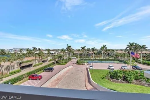View of community featuring uncovered parking