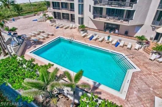 Community pool with a patio area