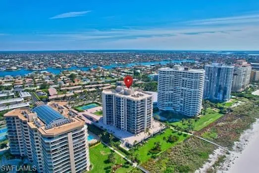 Aerial view with a city view and a water view