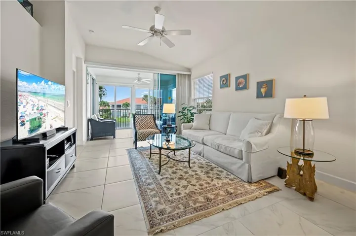 Spacious living room with lake and fountain view