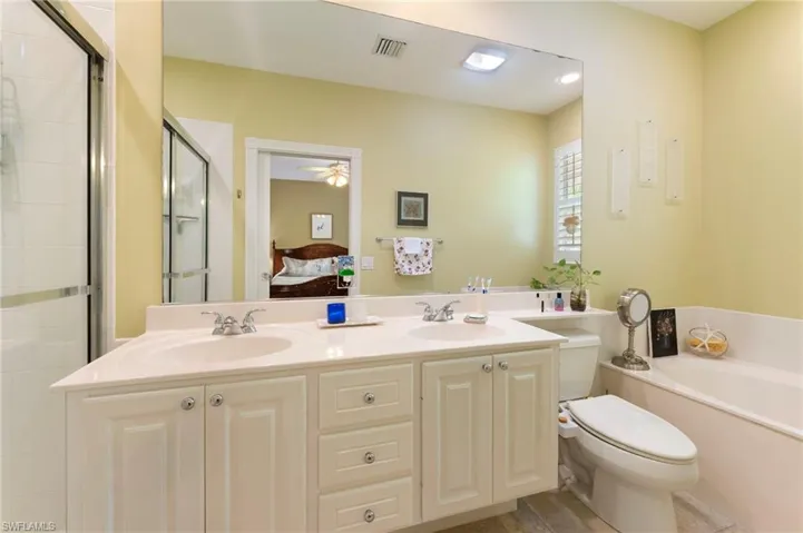 15361 Laughing Gull Ln. Bonita Springs FL 34135 - Owners bath with dual sinks and separate tub and shower.