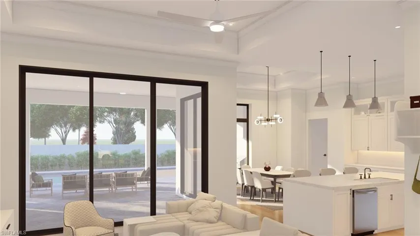 Living room with crown molding, a raised ceiling, hanging lights, light wood-style flooring, and a ceiling fan