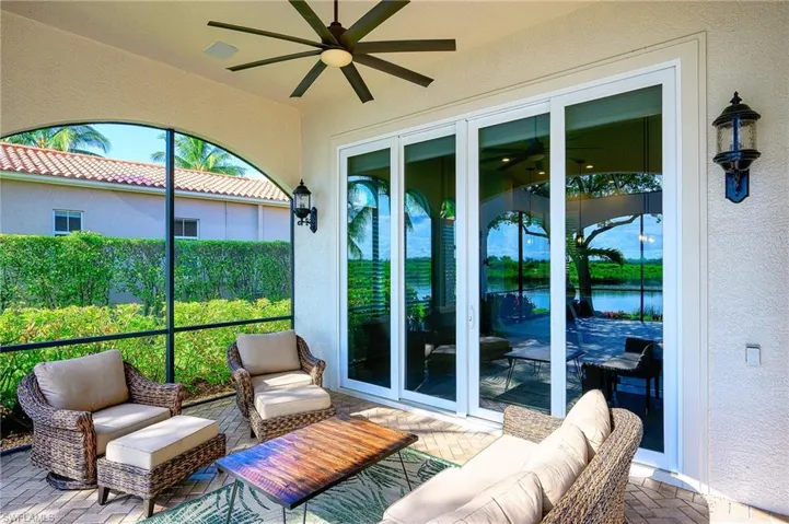 Sunroom featuring ceiling fan