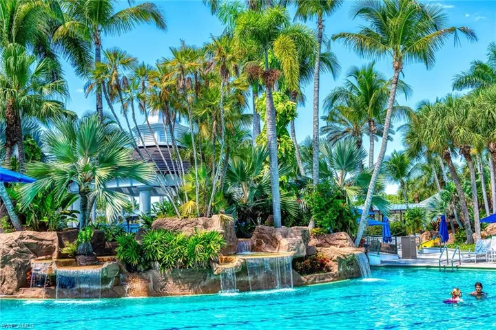 View of swimming pool with pool water feature