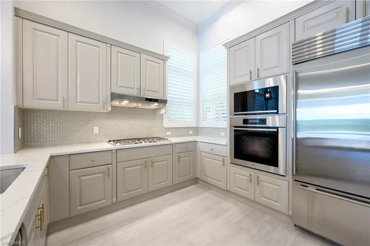 Kitchen featuring quartz countertops, stainless steel appliances
