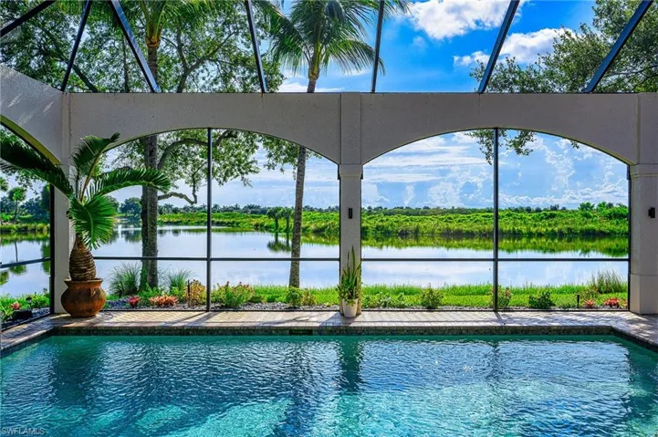 View of swimming pool featuring a water view
