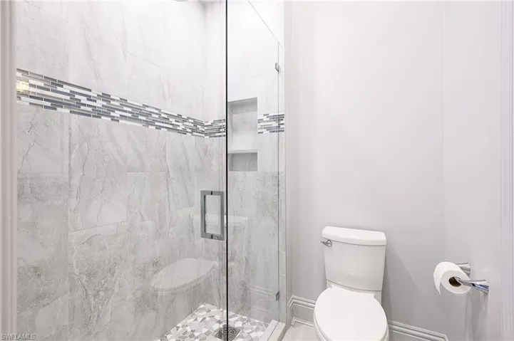 Bathroom featuring toilet and walk in shower
