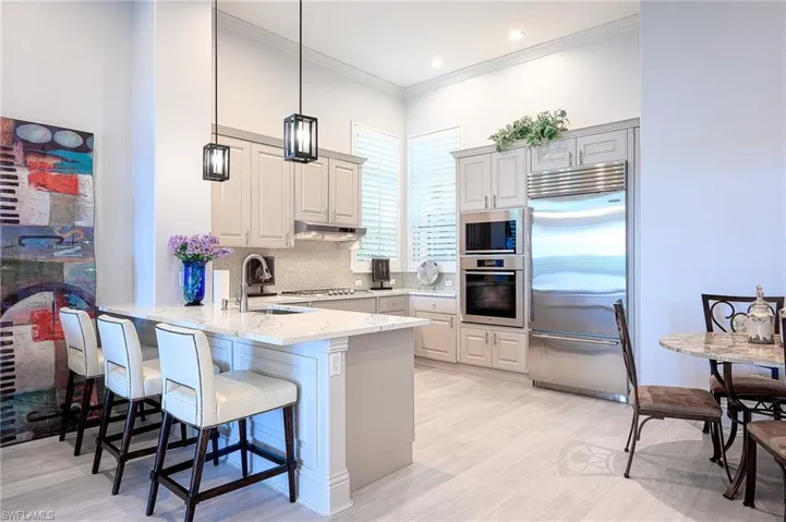 Kitchen featuring quartz countertops, stainless steel appliances