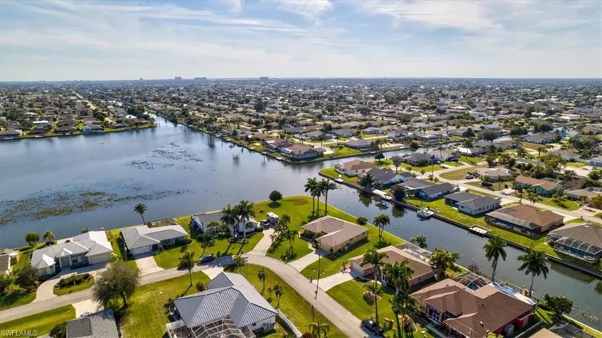 Aerial view of residential area with a nearby body of water