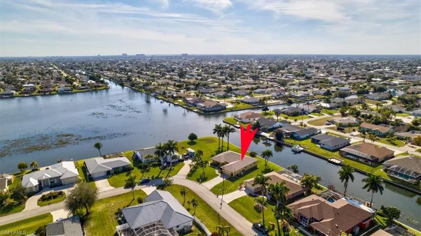 Aerial view of residential area with a large body of water