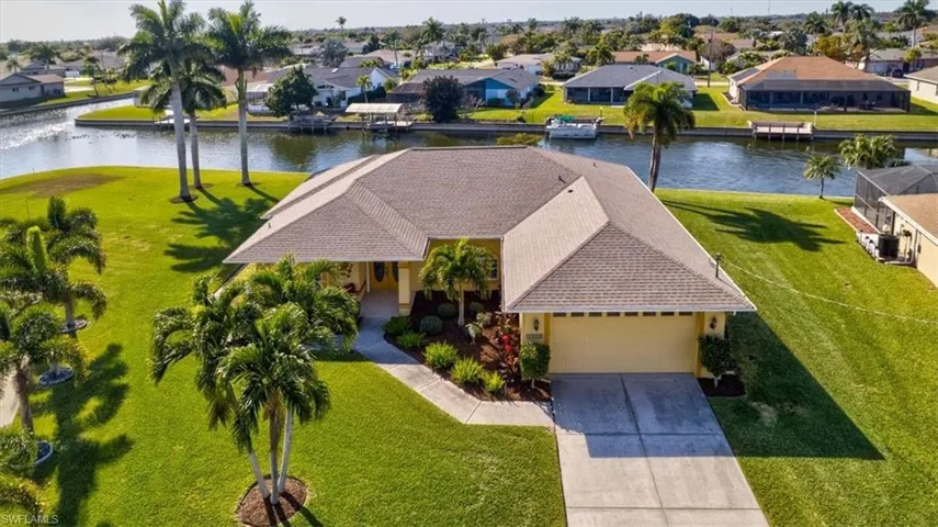 Aerial perspective of suburban area with a nearby body of water