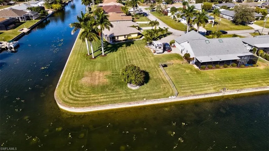 View of property location with a nearby body of water and nearby suburban area