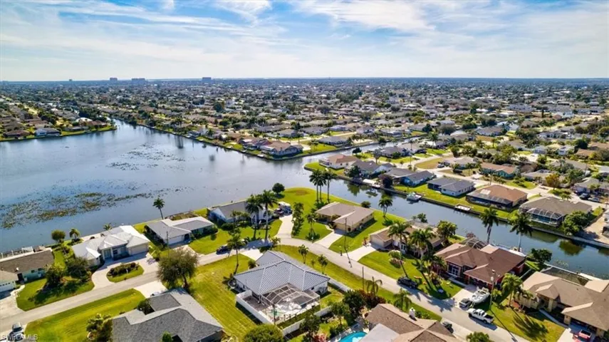 Aerial perspective of suburban area with a large body of water
