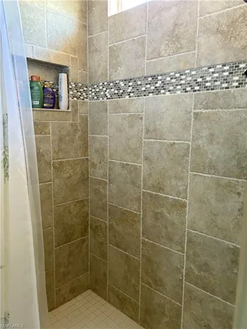 Bathroom with tiled shower