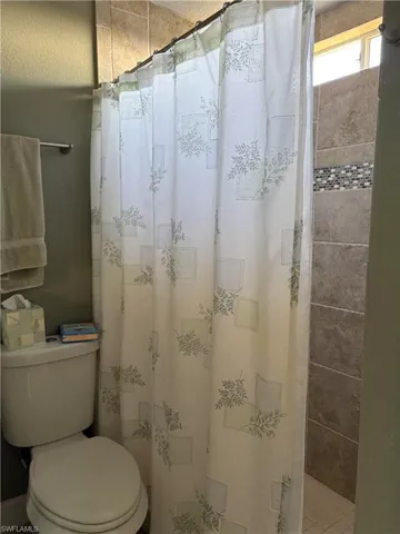 Full bathroom featuring toilet