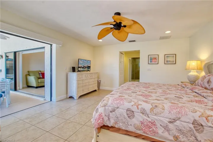Bedroom featuring light tile patterned floors, recessed lighting, and a ceiling fan
