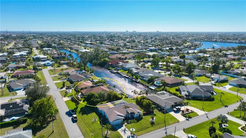 Aerial view of residential area with a nearby body of water