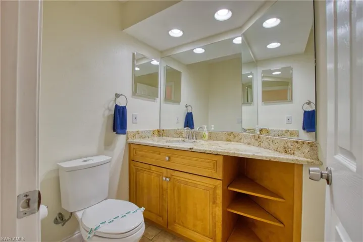 Bathroom with vanity and light tile patterned flooring