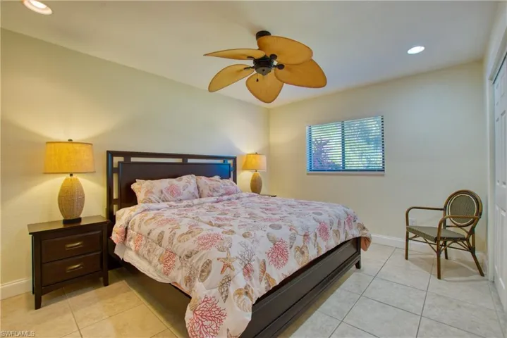 Bedroom featuring recessed lighting, light tile patterned floors, and a ceiling fan
