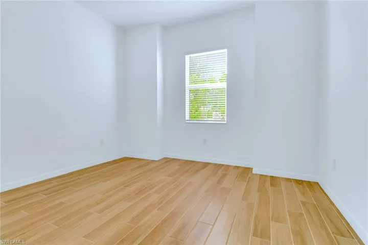 Unfurnished room with light wood-style flooring